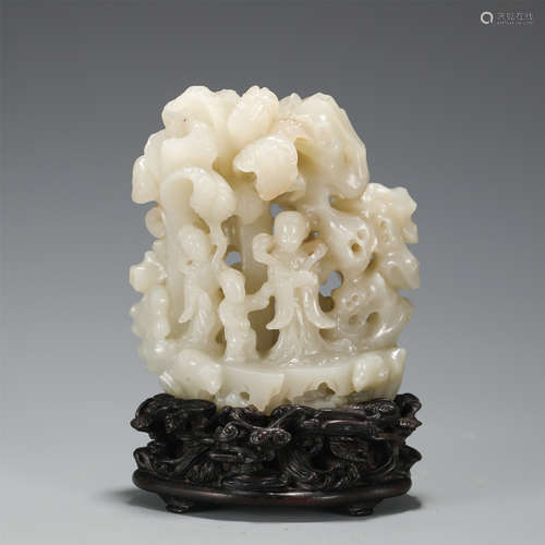 A FINE CARVED WHITE JADE BOULDER WITH WOODEN STAND