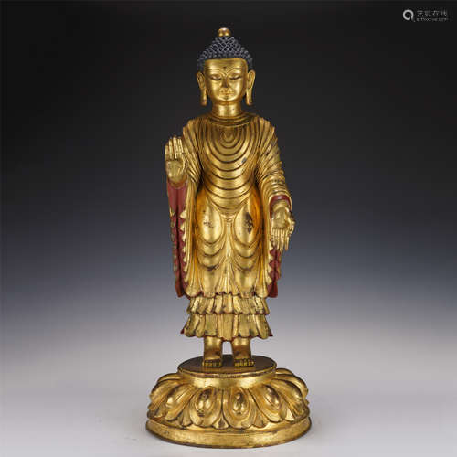 A GILT-BRONZE STANDING BUDDHA