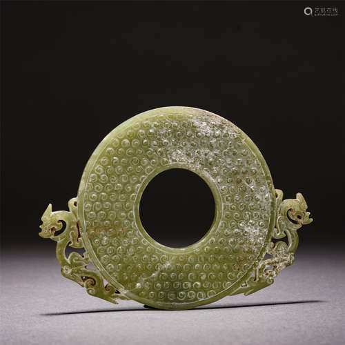 A CARVED CELADON JADE DISC BI