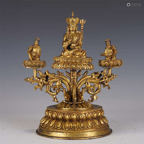 A GILT-BRONZE PADMASAMBHAVA WITH ACOLYTES