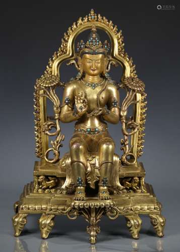 A LARGE GILT-BRONZE SEATED DIPAMKARA