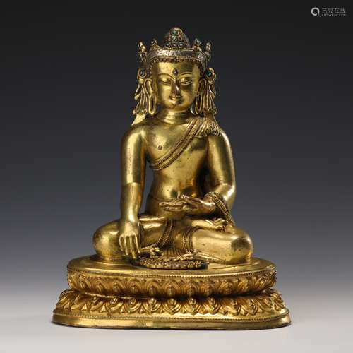 A GILT-BRONZE SEATED CROWN BUDDHA