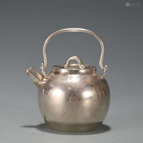 A SILVER TEAPOT