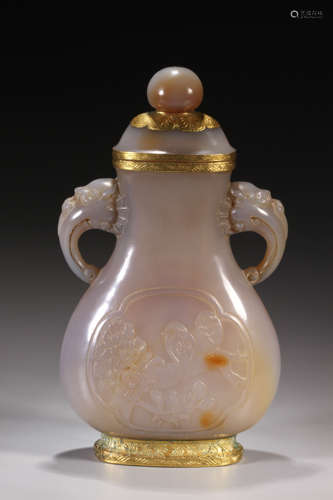 A BRONZE-GILT MOUNTED CARVED AGATE VASE