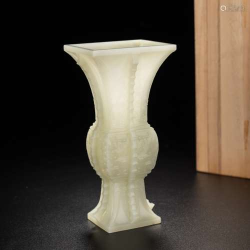 A CARVED WHITE JADE BEAKER VASE GU