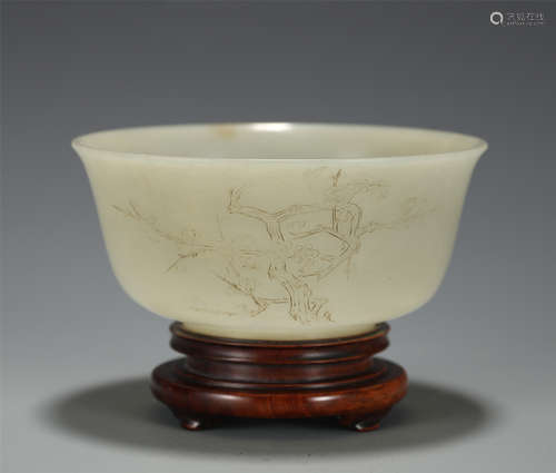 AN INCISED WHITE JADE BOWL WITH WOODEN STAND