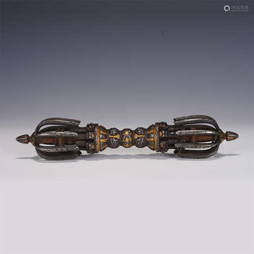 AN IRON GILT VAJRA