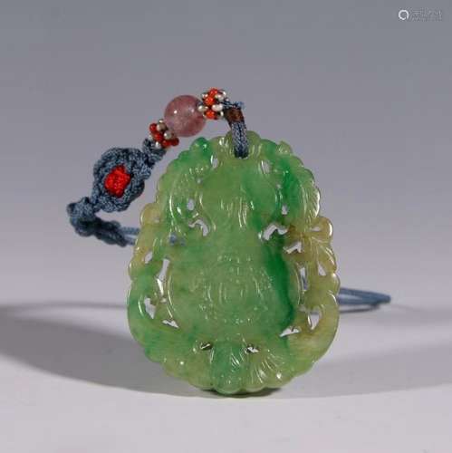 A CARVED JADEITE PENDANT