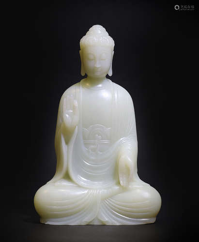 A CARVED WHITE JADE BUDDHA