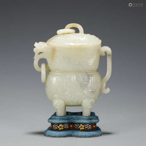 AN ARCHAIC CARVED WHITE JADE VESSEL