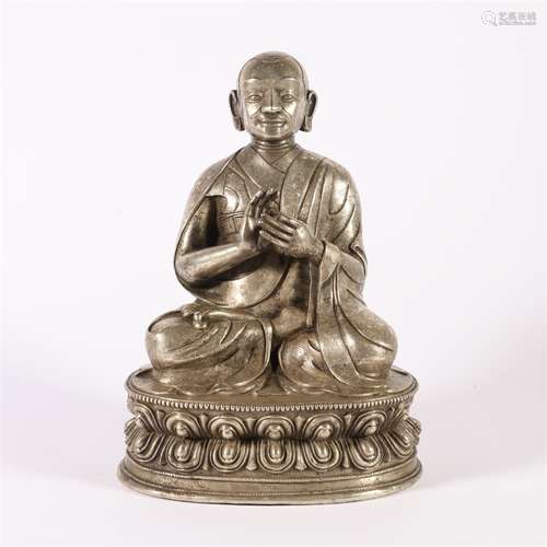 A Silver Guru Buddha Statue