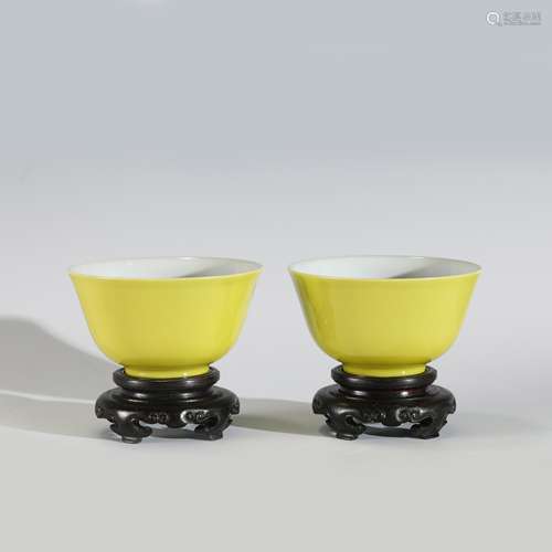 QING YONGZHENG YELLOW GLAZED BOWLS ON STANDS