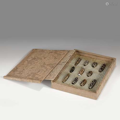 SET OF ELEVEN DZI BEADS ON BOX