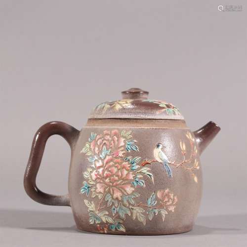 A Chinese Yixing Zisha Teapot with Flower Pattern