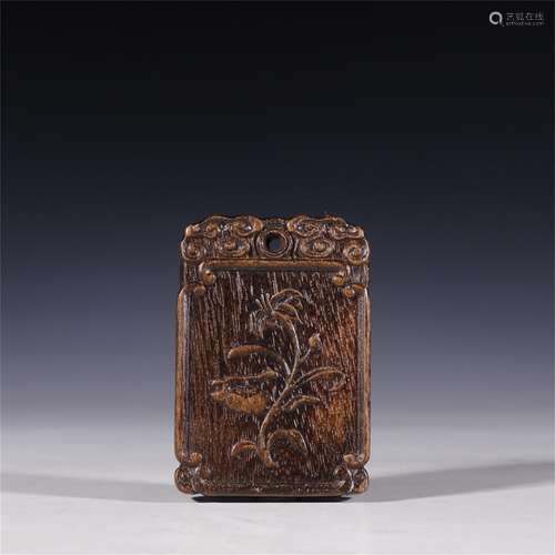 A Chinese Carved Agarwood Flower Patterned Pendant