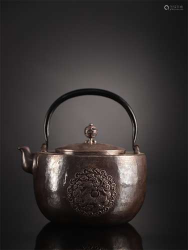 A Chinese Silver Teapot with Handle