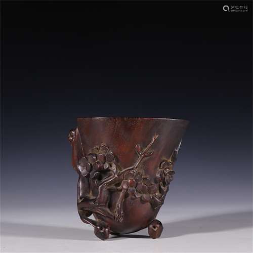 A Chinese Carved Zitan Wood Plum Blossom Cup