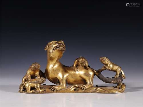 A Chinese Gilt Bronze Beast Shaped Brush Rest