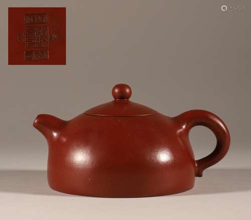 dark-red enameled pottery teapot