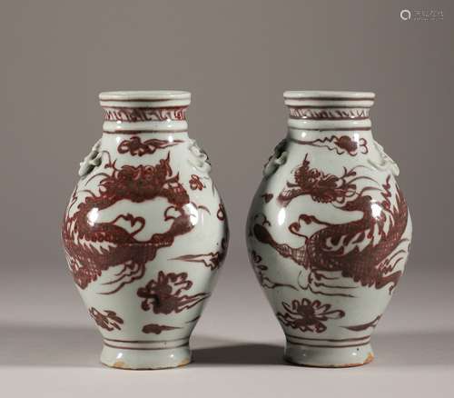 A pair of Yuan Dynasty underglaze red olive bottles