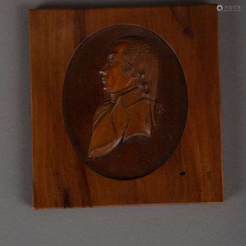 Cadre en bois à décor sculpté en relief d'un buste d'homme d...