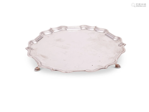 A SILVER SHAPED CIRCULAR SALVER BY GARRARD & CO. LTD