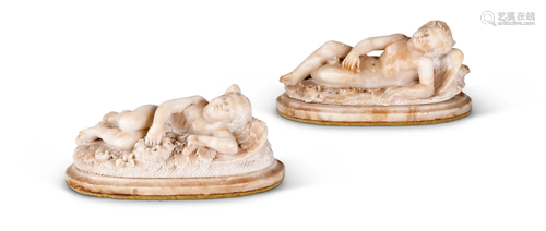 TWO SIMILAR ALABASTER MODELS OF RECUMBENT WINGED