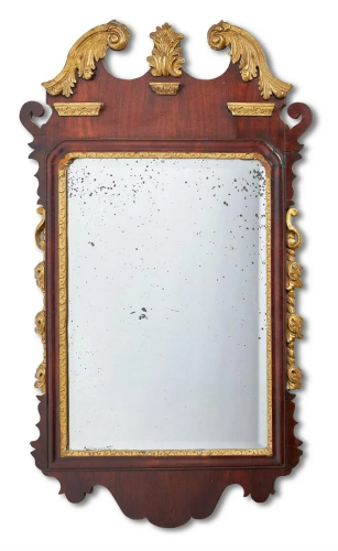 A MAHOGANY AND GILTWOOD FRET FRAME MIRROR, MI…