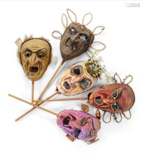 A GROUP OF FIVE MOULDED PAPER GROTESQUE CARVIVAL MASKS