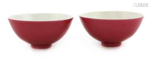 A pair of Chinese ruby-enamelled tea bowls,