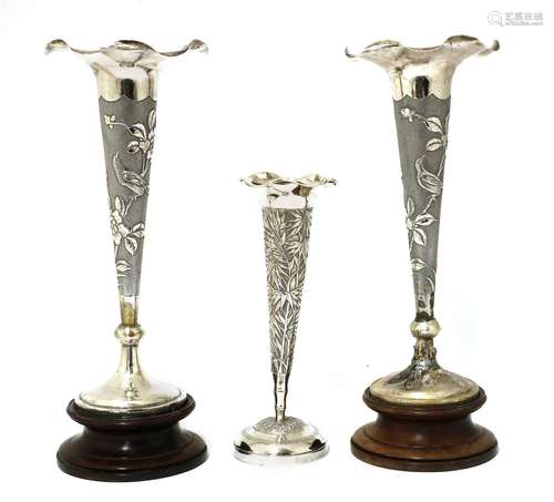 A pair of Chinese export silver repoussé vases,