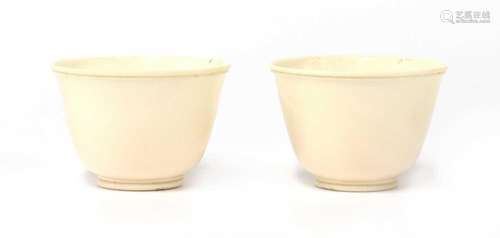 A pair of Chinese ivory cups,