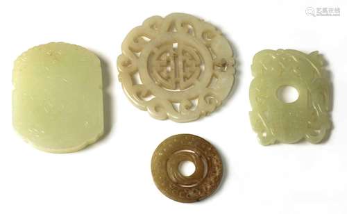 A collection of four Chinese jade pendants,