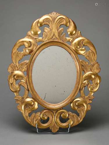 Miroir ovale en bois doré à décor sculpté et ajouré 19ème si...