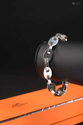 HERMÈS.Bracelet en argent 925 millièmes composé de vingt mai...