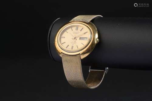 SEIKO.Montre bracelet d'homme en acier plaqué or modèle 