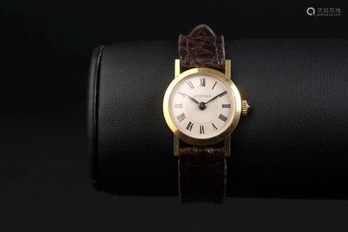 CARTIER.Montre bracelet de dame, le boîtier circulaire en or...