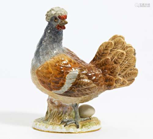 PORCELAIN FIGURINE OF CRESTED CHICKEN WITH EGG. Meissen. Dat...
