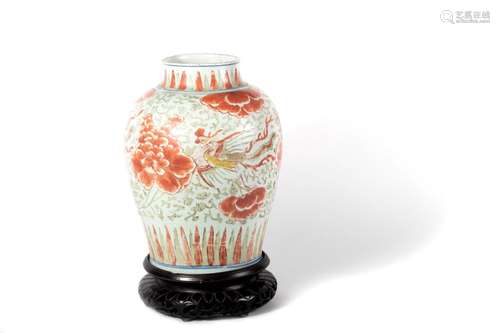 White, red and green porcelain vase with phoenixes and flora...