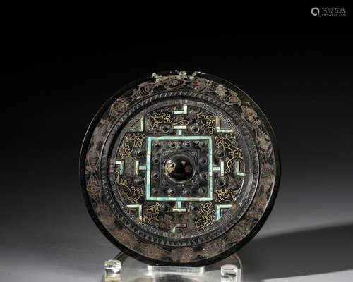 A CHINESE TURQUOISE-INLAID BRONZE MIRROR