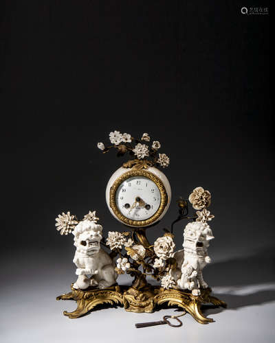 A WHITE PORCELAIN LION CLOCK,19TH CT.