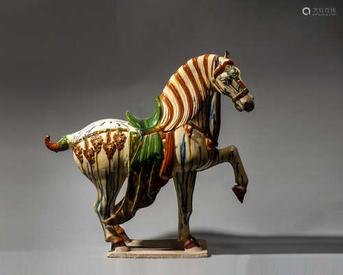 A CHINESE SANCAI-GLAZED POTTERY FIGURE OF HORSE,TANG DYNASTY