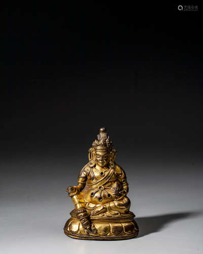 A CHINESE GILT-BRONZE FIGURE OF JAMBHALA,QING DYNASTY