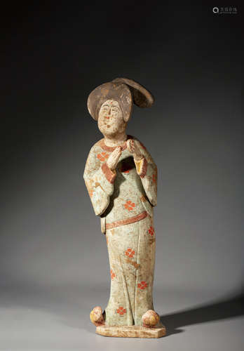 A CHINESE PAINTED RED POTTERY FIGURE OF A COURT LADY,TANG DY...