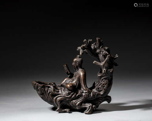 A CHINESE BRONZE 'IMMORTAL IN A RAFT' CARVING,QING DYNASTY