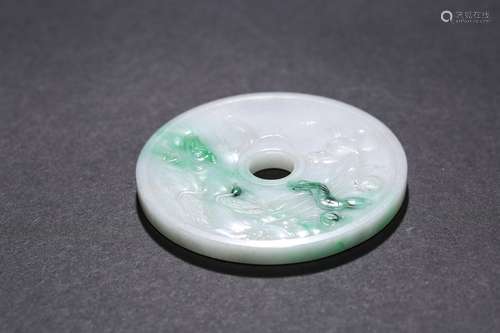 A CHINESE CARVED JADEITE DISC,QING DYNASTY