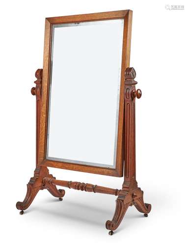 A VICTORIAN OAK CHEVAL GLASS MIRROR, CIRCA 1850