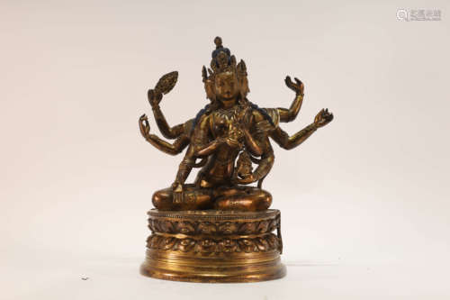 A Gilt Bronze Eight-Armed Attendant Buddhist Figure