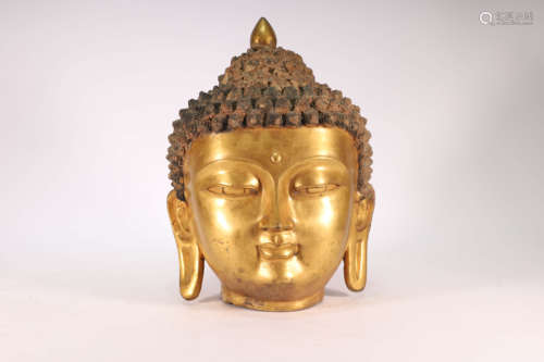 A Gilt Bronze Head of Buddha