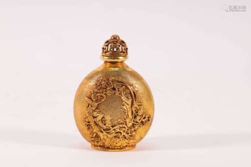 A gilt bronze snuff bottle with carved figures